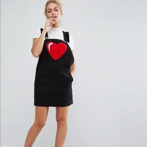 Black overall dress with heart.